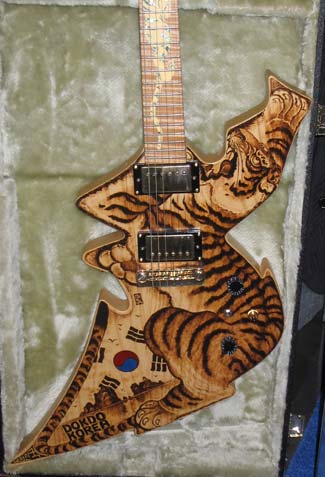 cool pictures of guitars.  amongst the various knock-off swine was this cool Korean tiger guitar.